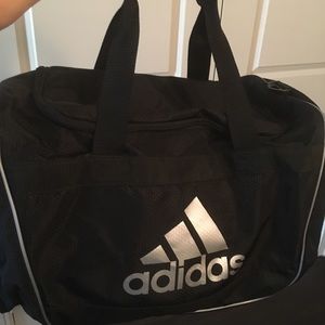 Black Adidas athletic duffle bag
